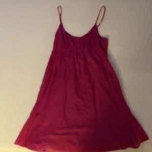 A bright pink dress that has white dots.